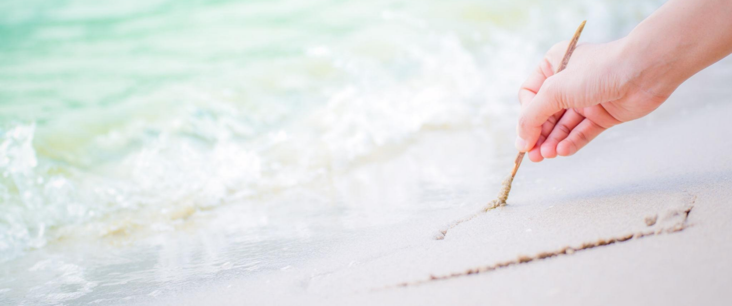 Walking by the sea and writing in the sand